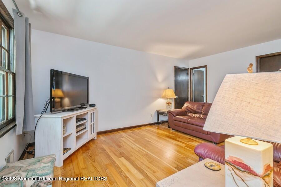 1711 Glendola Road Wall, NJ 07719 - Photo 13 of 25 a bedroom with a bed and flat screen tv