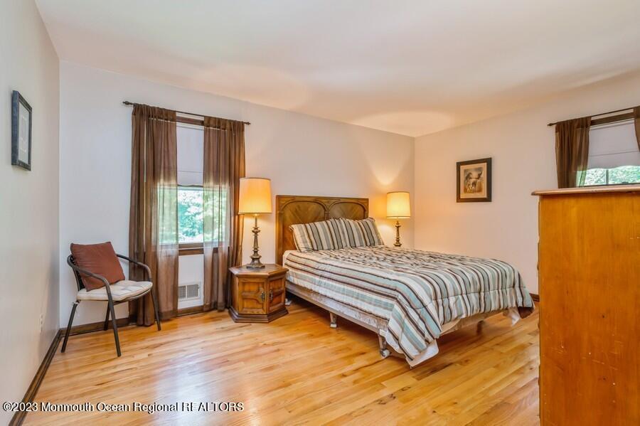 1711 Glendola Road Wall, NJ 07719 - Photo 20 of 25 a bedroom with a bed chair and a window