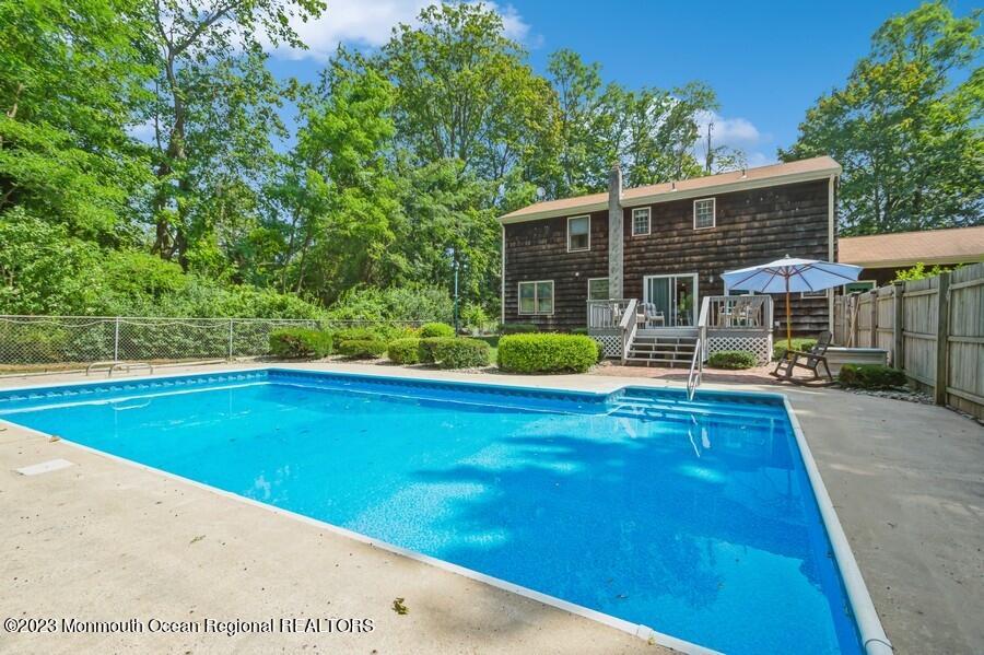 1711 Glendola Road Wall, NJ 07719 - Photo 2 of 25 a view of a house with pool