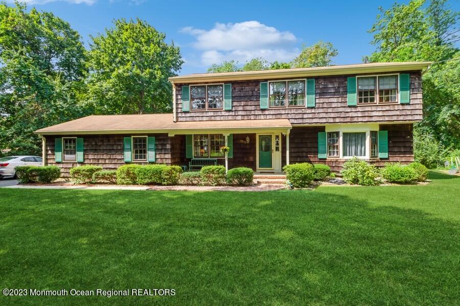 1711 Glendola Road Wall, NJ 07719 - Photo 25 of 25 a front view of a house with yard patio and green space