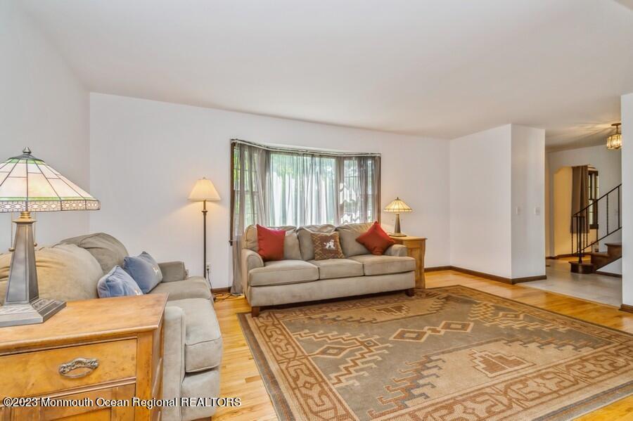 1711 Glendola Road Wall, NJ 07719 - Photo 5 of 25 a living room with furniture and a rug