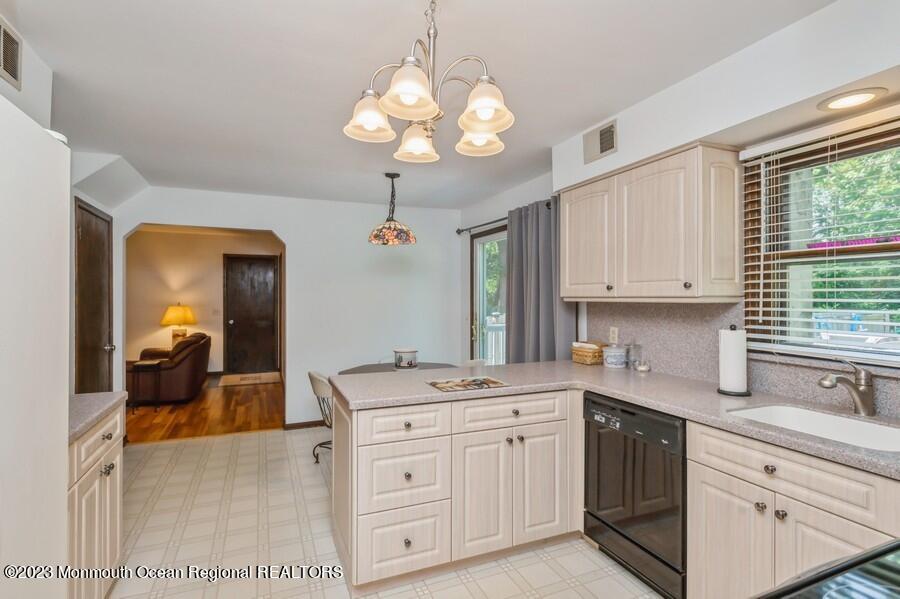 1711 Glendola Road Wall, NJ 07719 - Photo 8 of 25 a kitchen with a sink cabinets and window