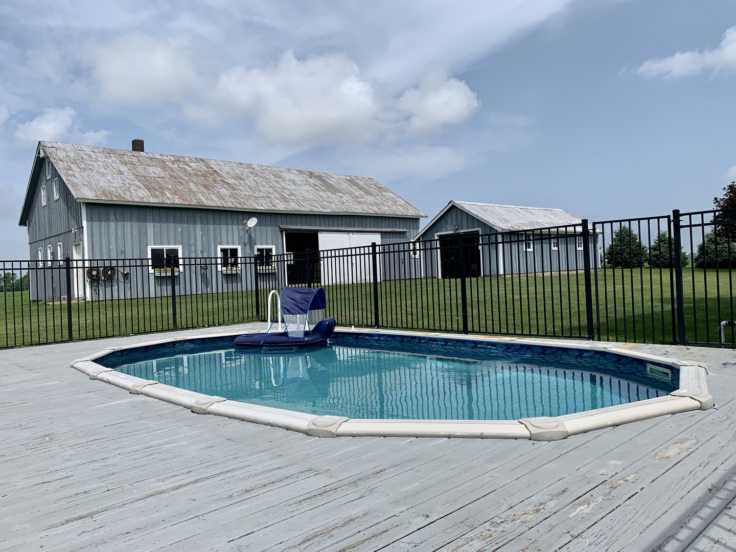 18140 West Breen Road Elwood, IL 60421 - Photo 22 of 53 a view of a house with a swimming pool and a yard