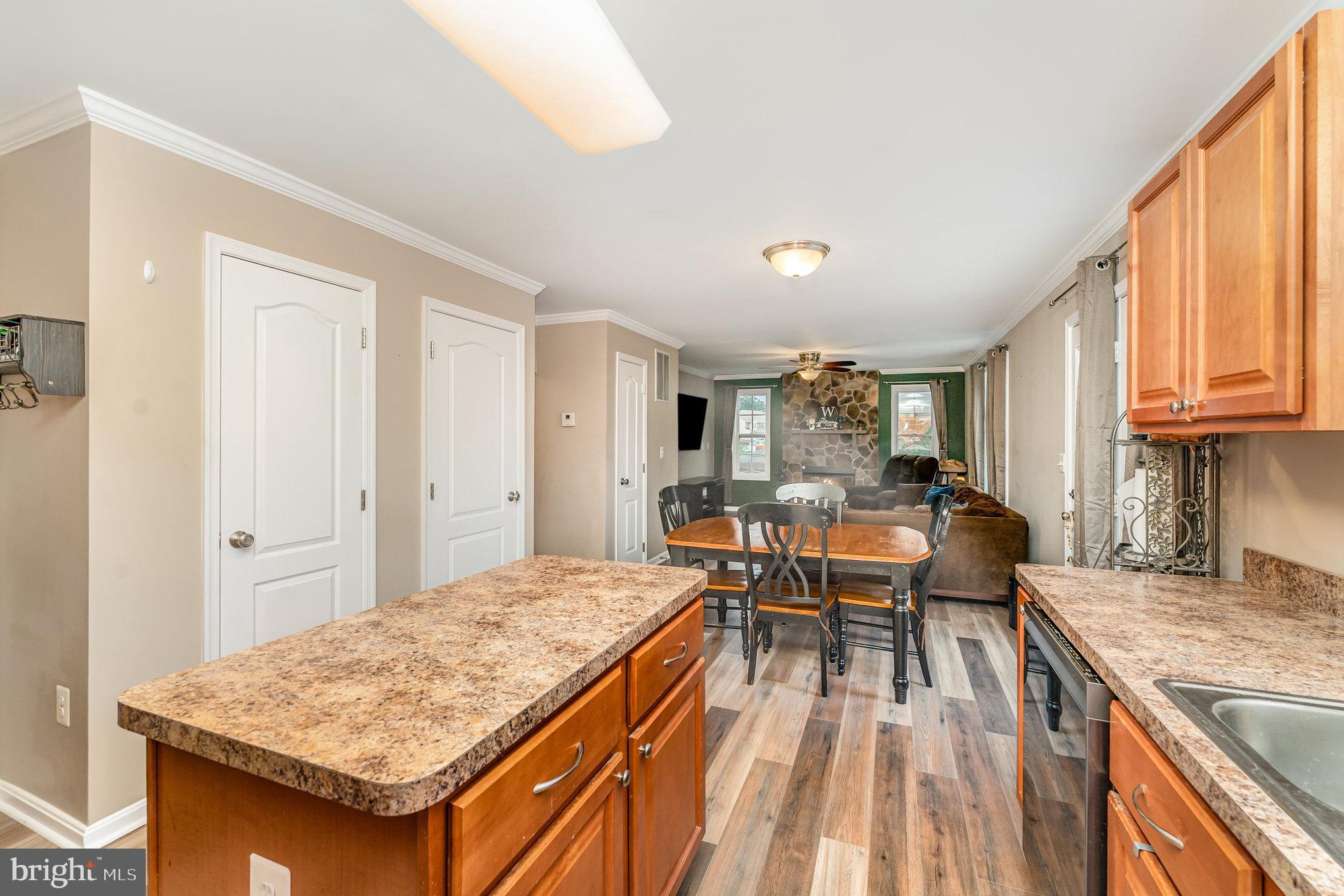 6139 Schooner Circle King George, VA 22485 - Photo 12 of 29 a kitchen with a table chairs and wooden floor