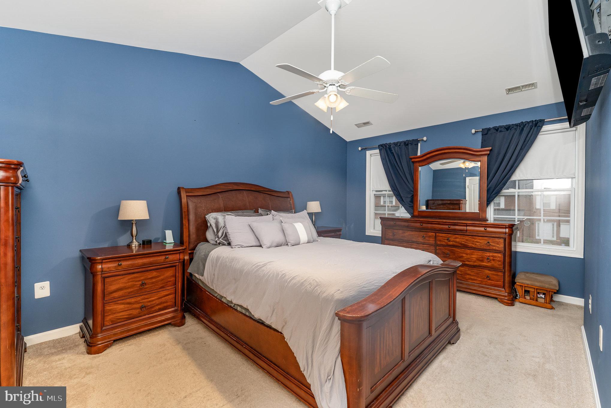 6139 Schooner Circle King George, VA 22485 - Photo 15 of 29 a bedroom with a bed and a chandelier