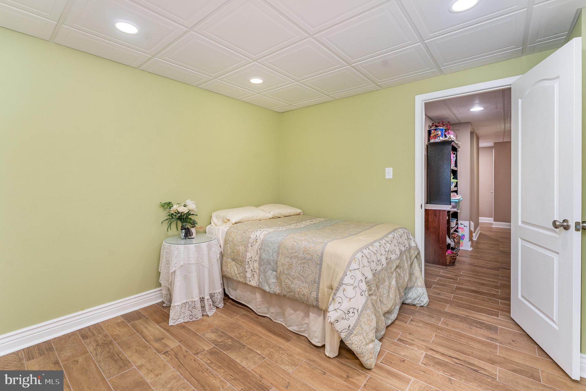6139 Schooner Circle King George, VA 22485 - Photo 24 of 29 a spacious bedroom with a bed and a table