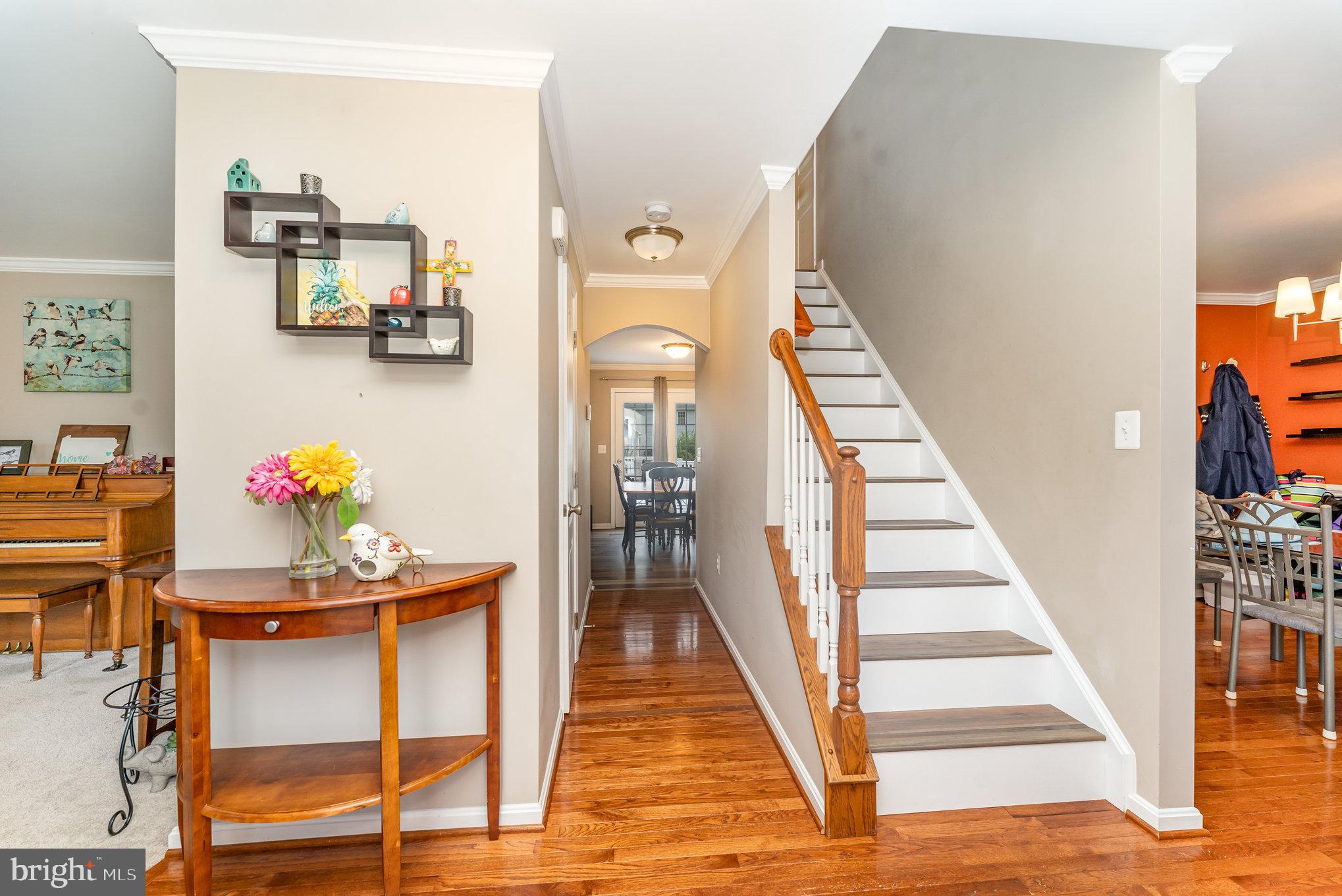 6139 Schooner Circle King George, VA 22485 - Photo 5 of 29 a view of a hallway with furniture and wooden floor