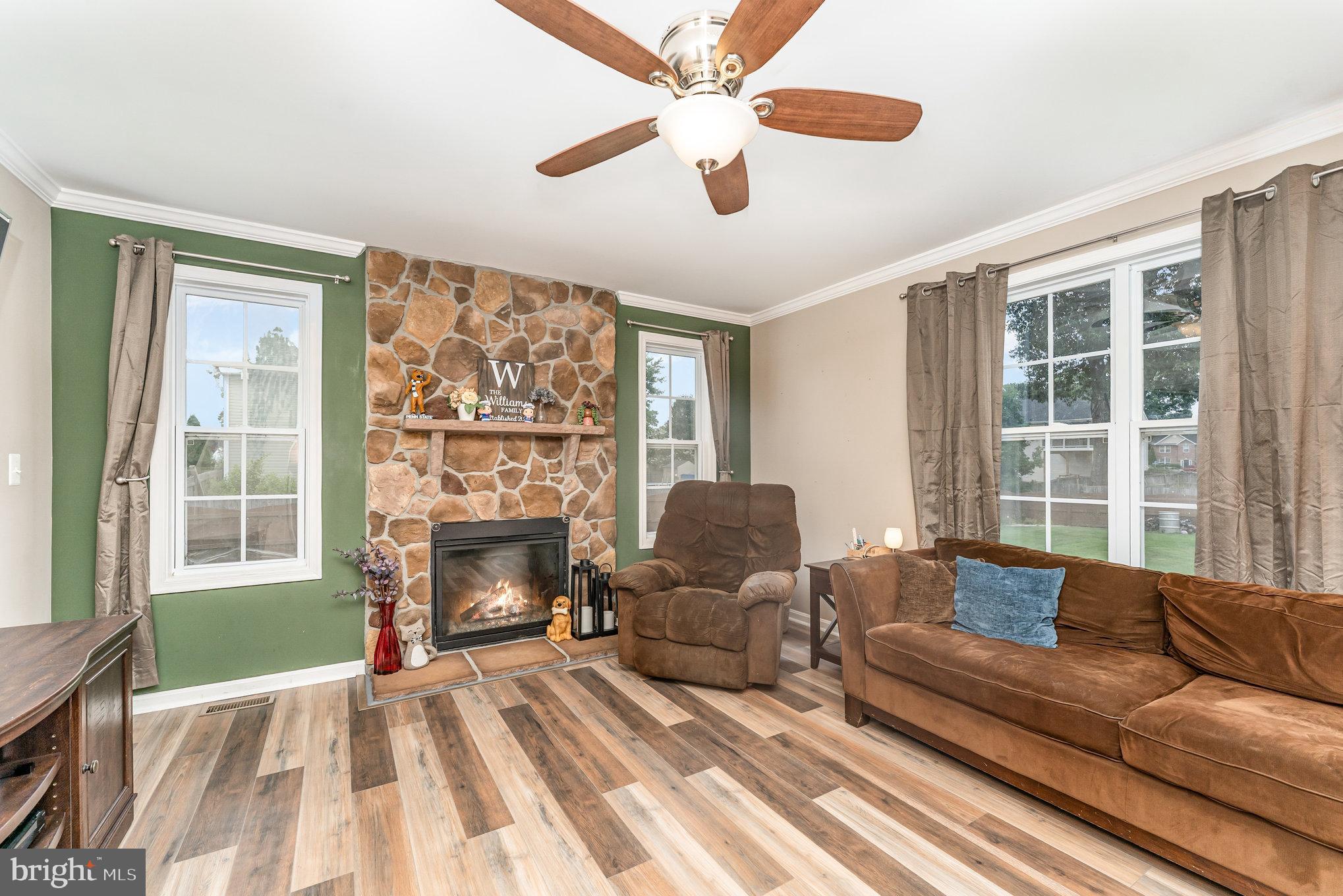 6139 Schooner Circle King George, VA 22485 - Photo 7 of 29 a living room with furniture and a fireplace
