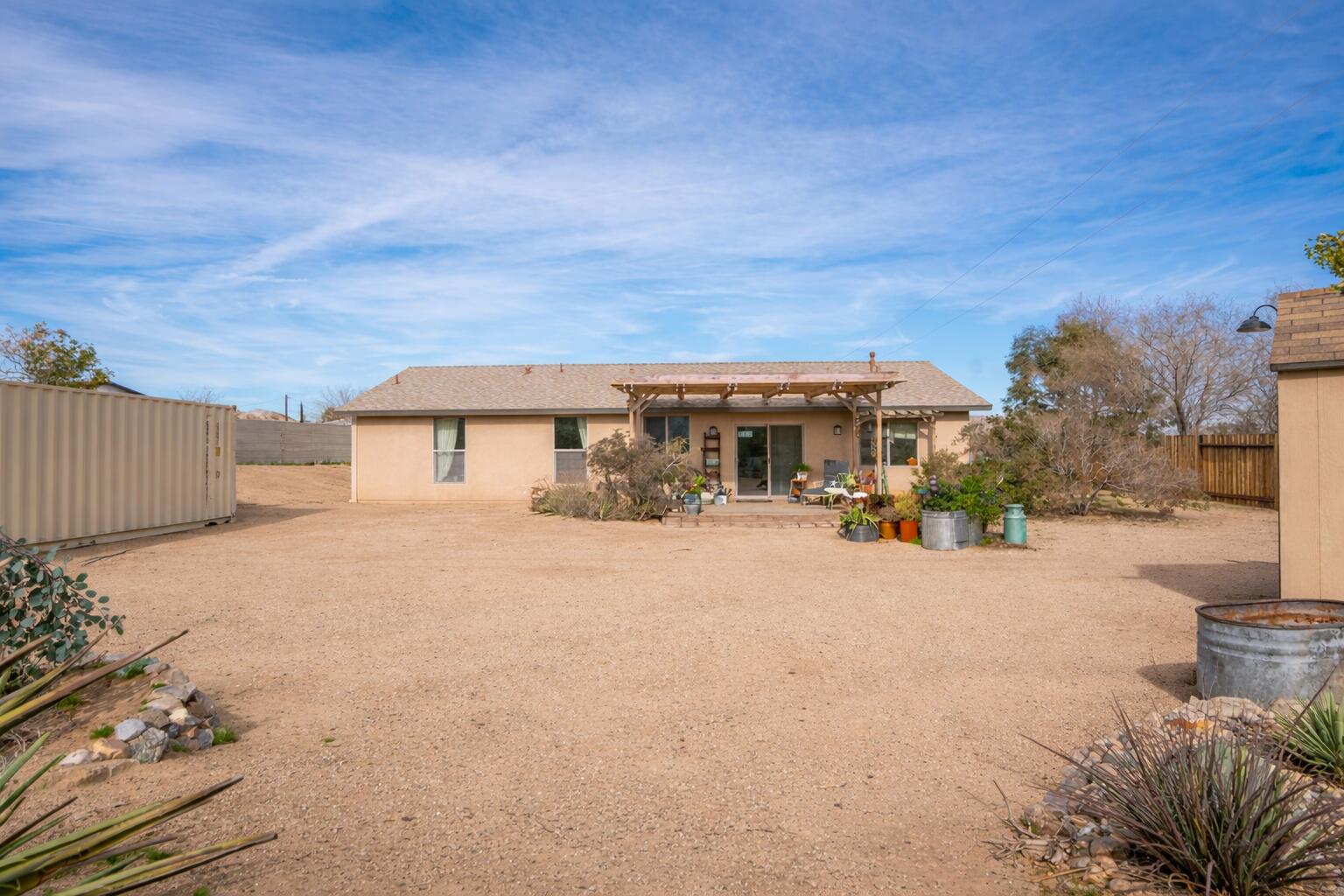 61869 Grand View Circle Joshua Tree, CA 92252 - Photo 26 of 34 Backyard looking at house