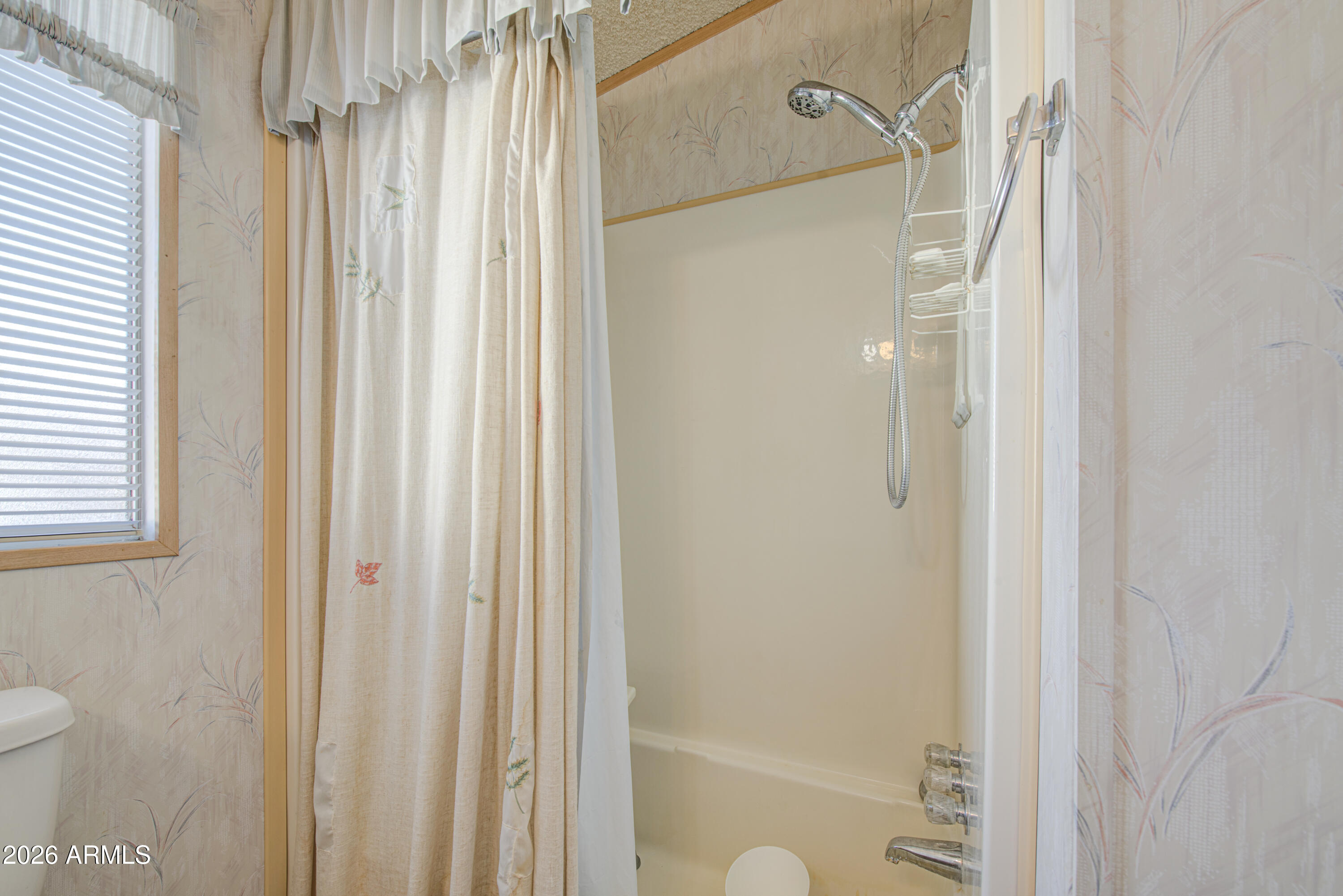 7750 East Broadway Road, Unit 273 Mesa, AZ 85208 - Photo 13 of 36 a bathroom with a shower and a toilet