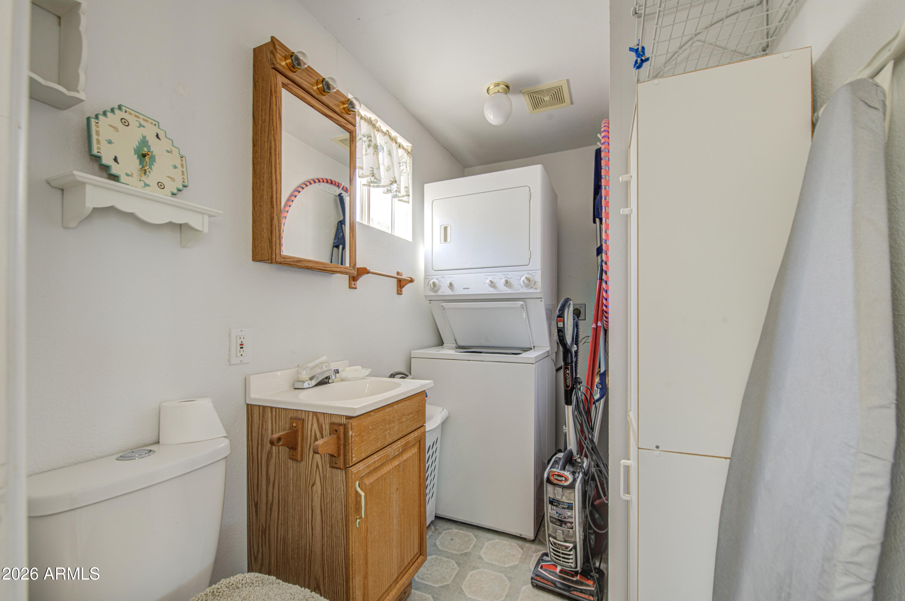 7750 East Broadway Road, Unit 273 Mesa, AZ 85208 - Photo 19 of 36 a bathroom with a sink and toilet