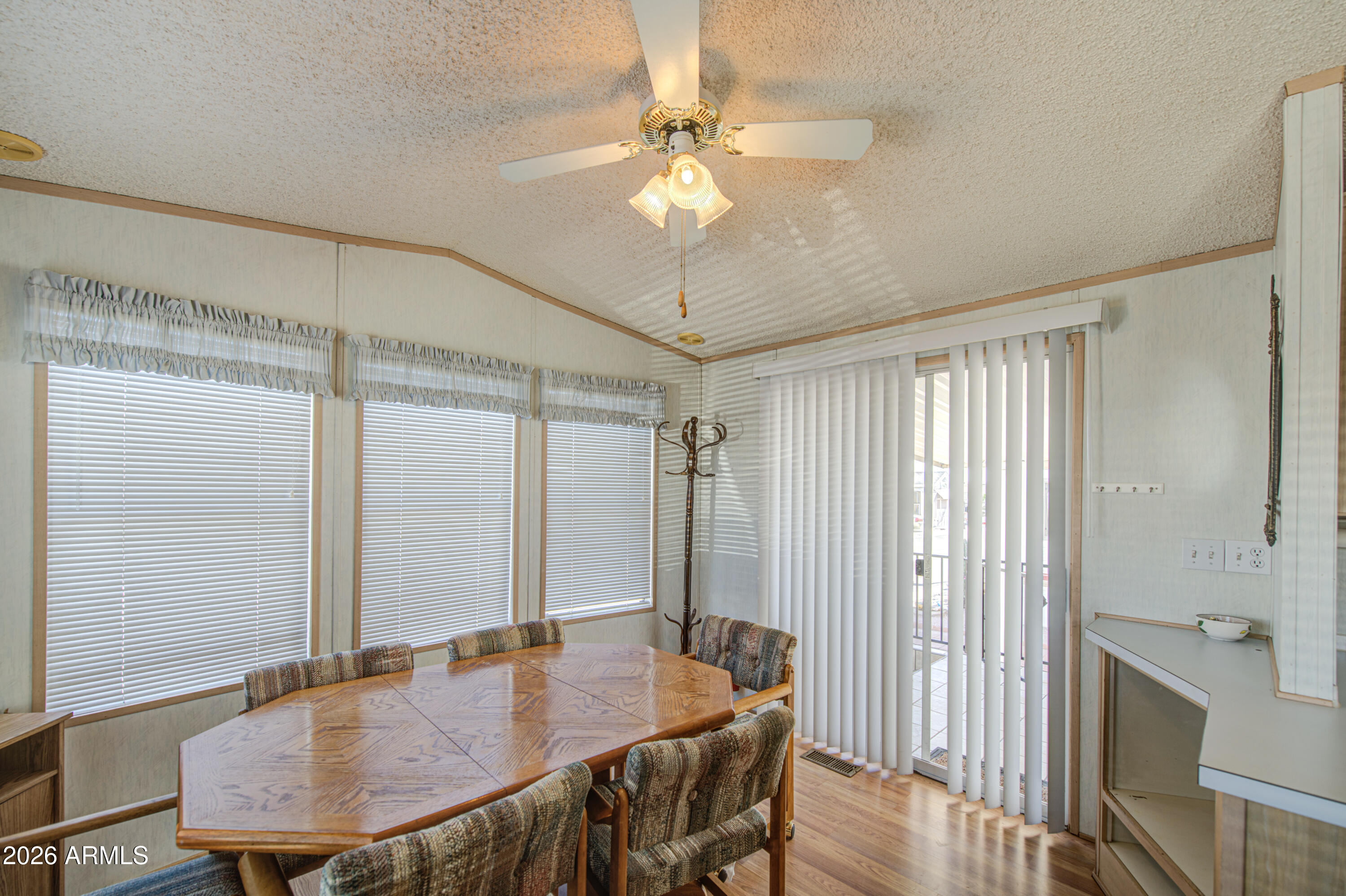 7750 East Broadway Road, Unit 273 Mesa, AZ 85208 - Photo 9 of 36 a dining room with furniture and window