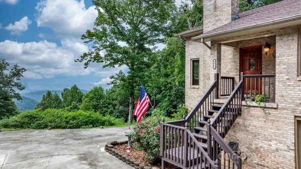 a view of wooden house with a street