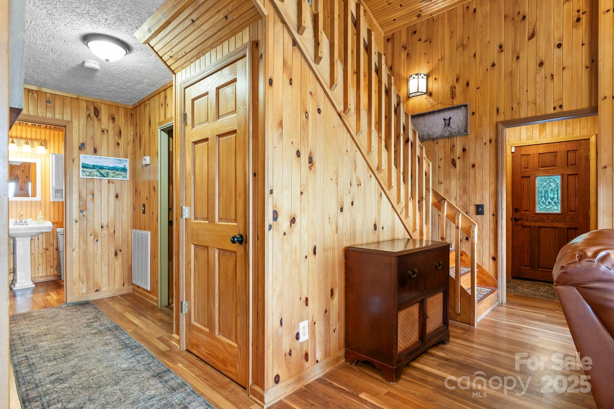 4415 Laurel Ridge Drive Lenoir, NC 28645 - Photo 13 of 48 a view of a hallway with wooden floor and staircase