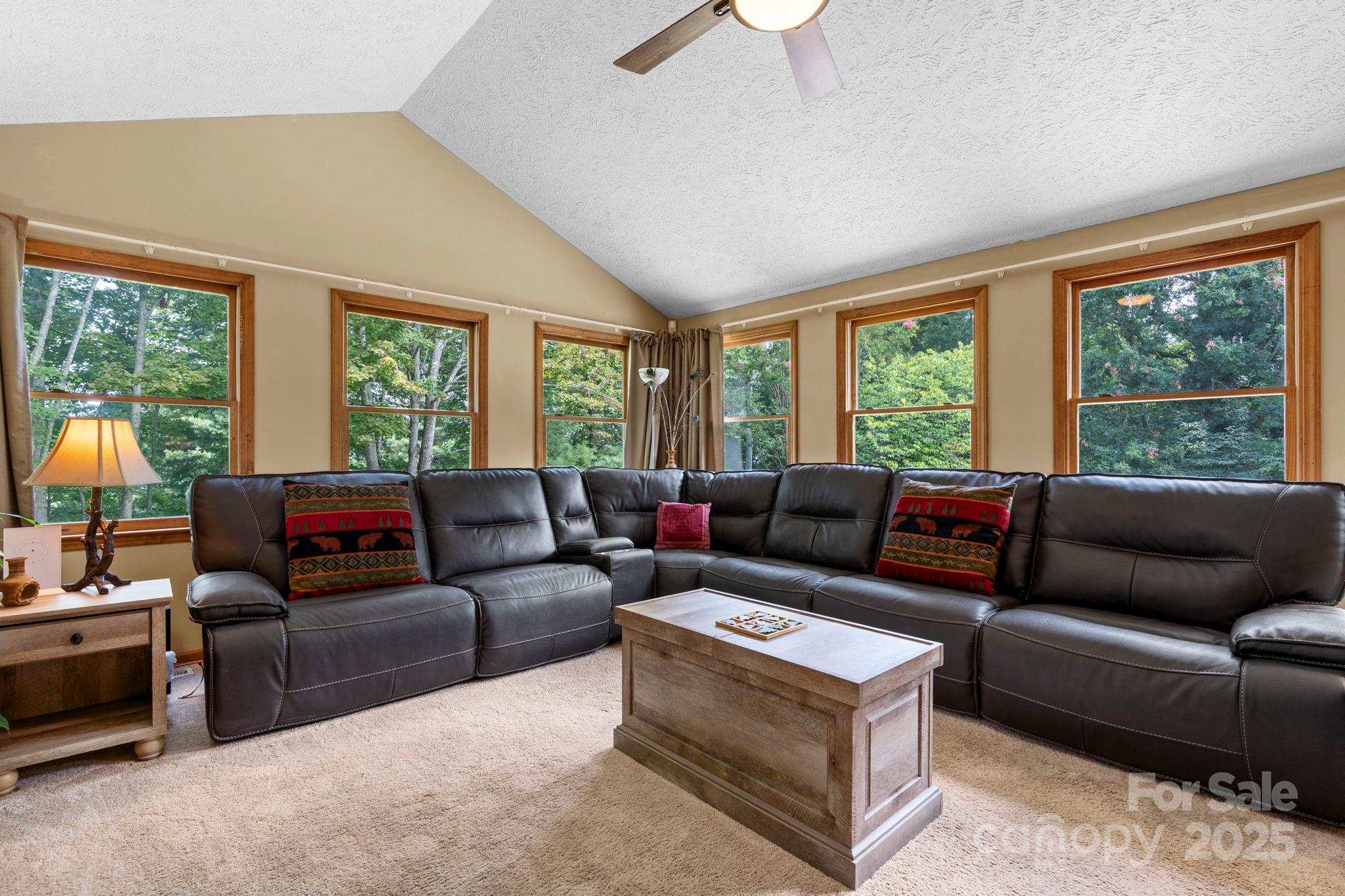 4415 Laurel Ridge Drive Lenoir, NC 28645 - Photo 14 of 48 a living room with furniture and a large window
