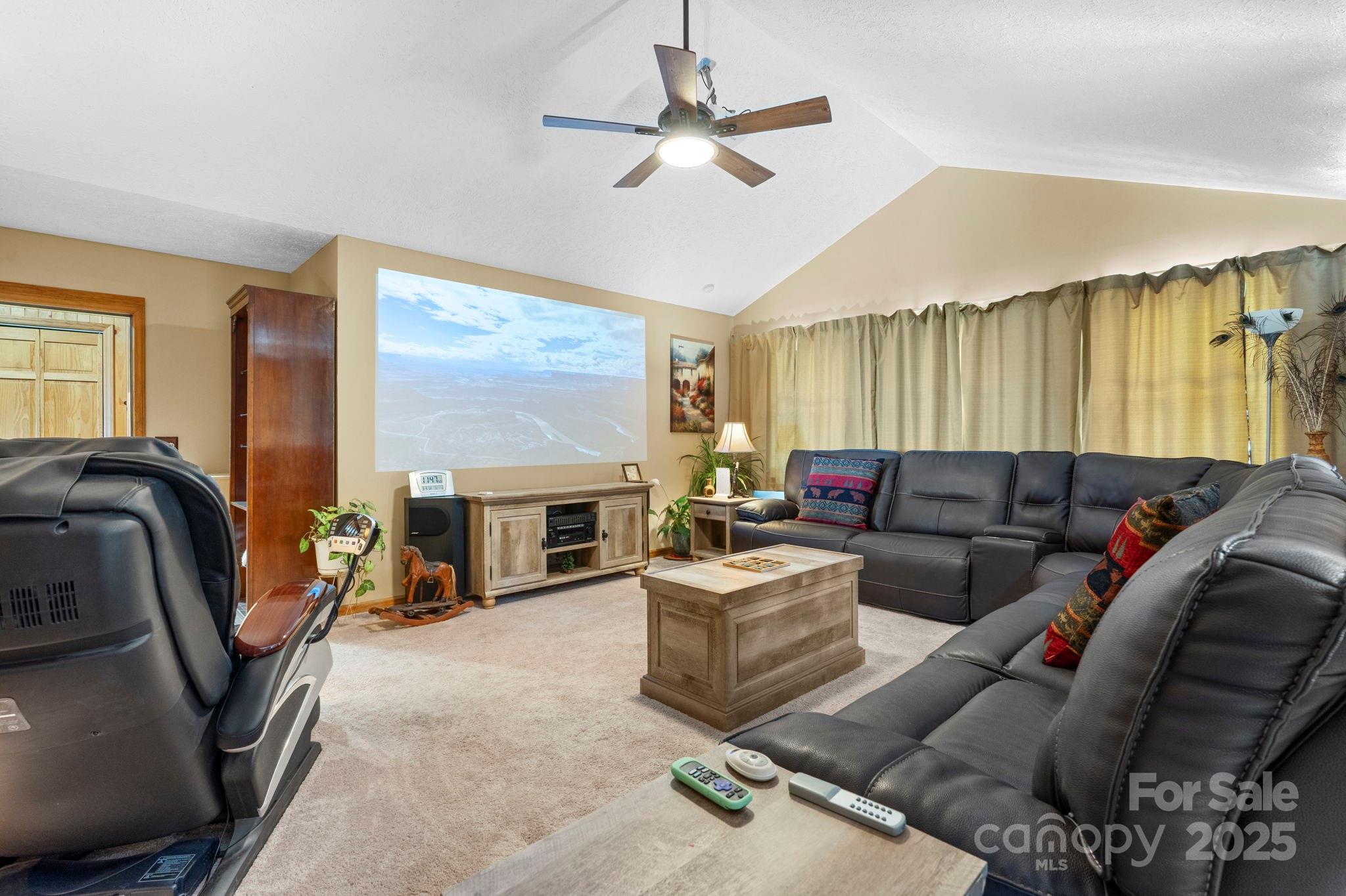 4415 Laurel Ridge Drive Lenoir, NC 28645 - Photo 15 of 48 a living room with furniture ceiling fan and a fireplace
