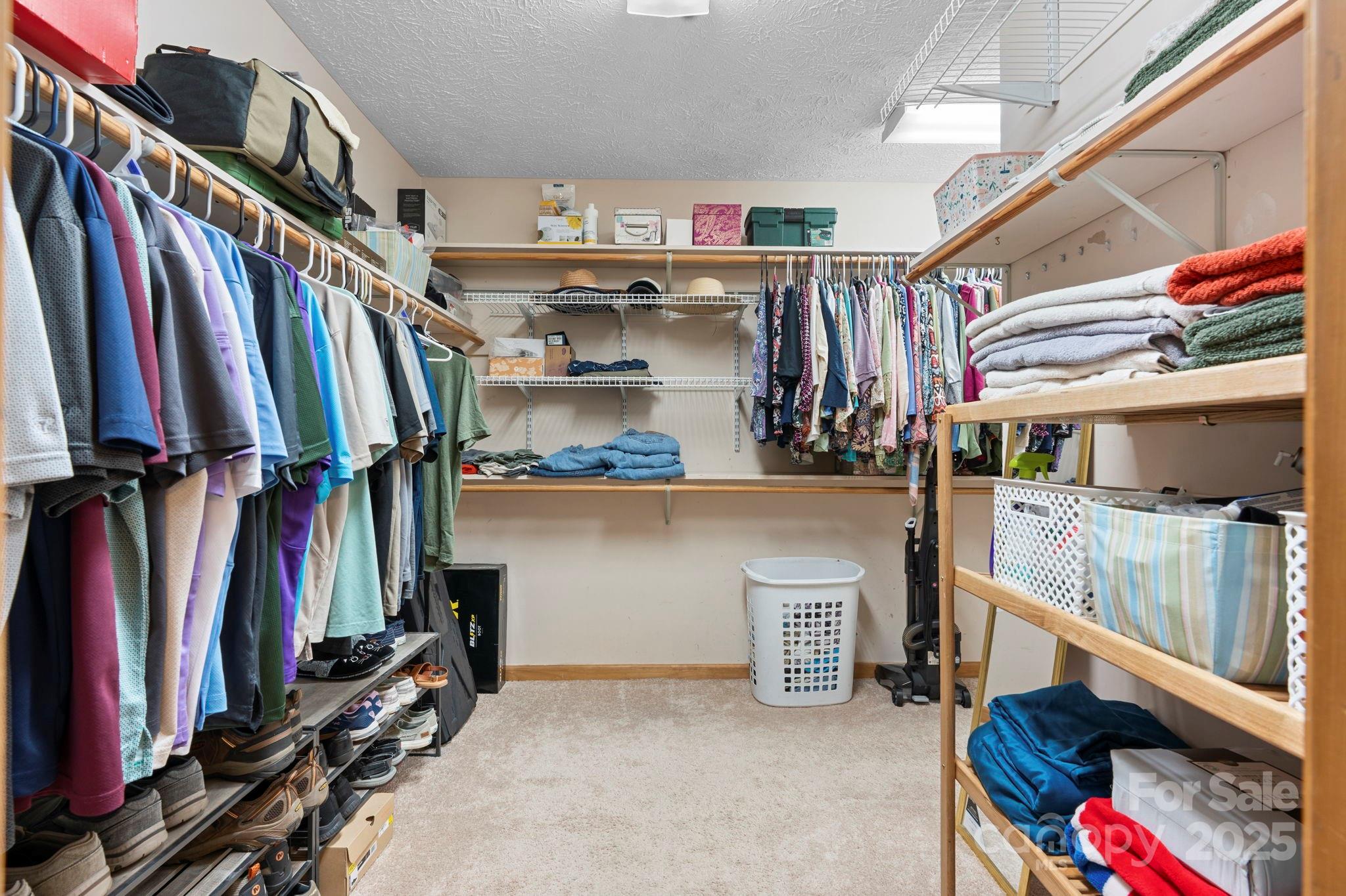 4415 Laurel Ridge Drive Lenoir, NC 28645 - Photo 18 of 48 a view of walk in closet with clothes and shoes