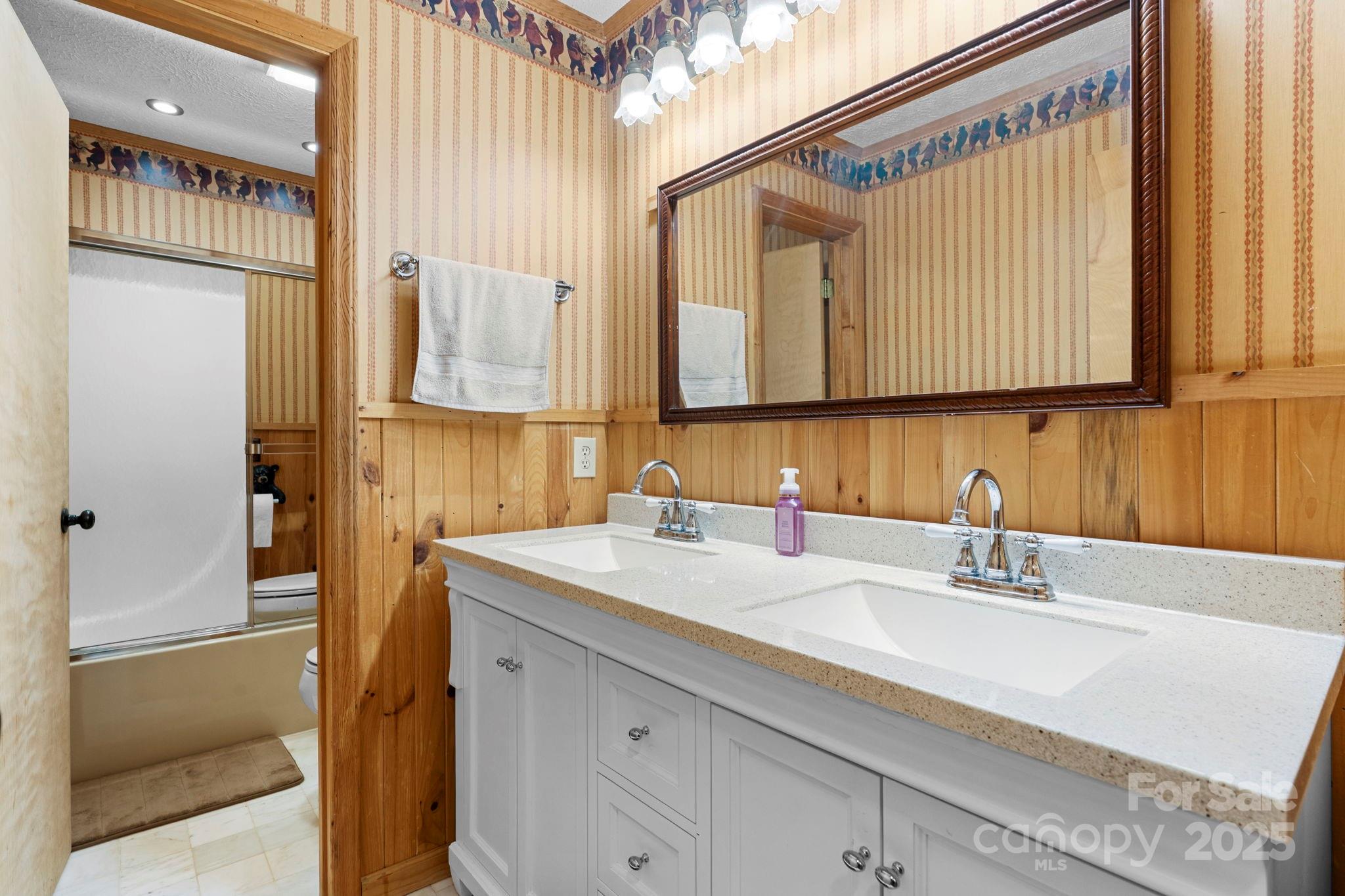 4415 Laurel Ridge Drive Lenoir, NC 28645 - Photo 22 of 48 a bathroom with a sink and a mirror
