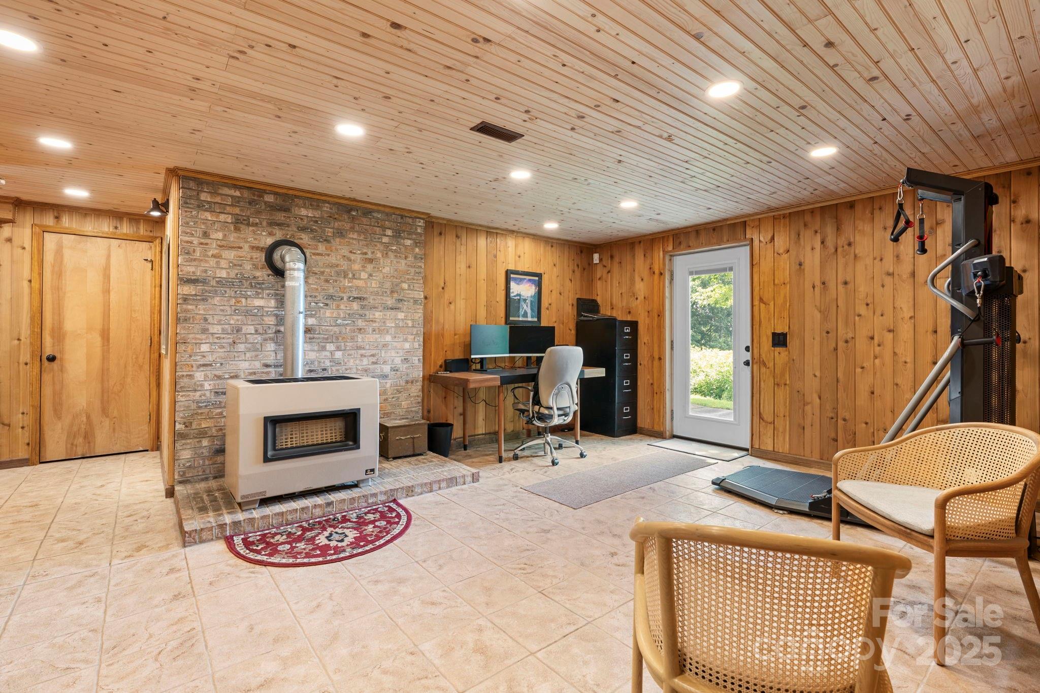 4415 Laurel Ridge Drive Lenoir, NC 28645 - Photo 26 of 48 a view of a livingroom with furniture and a fireplace