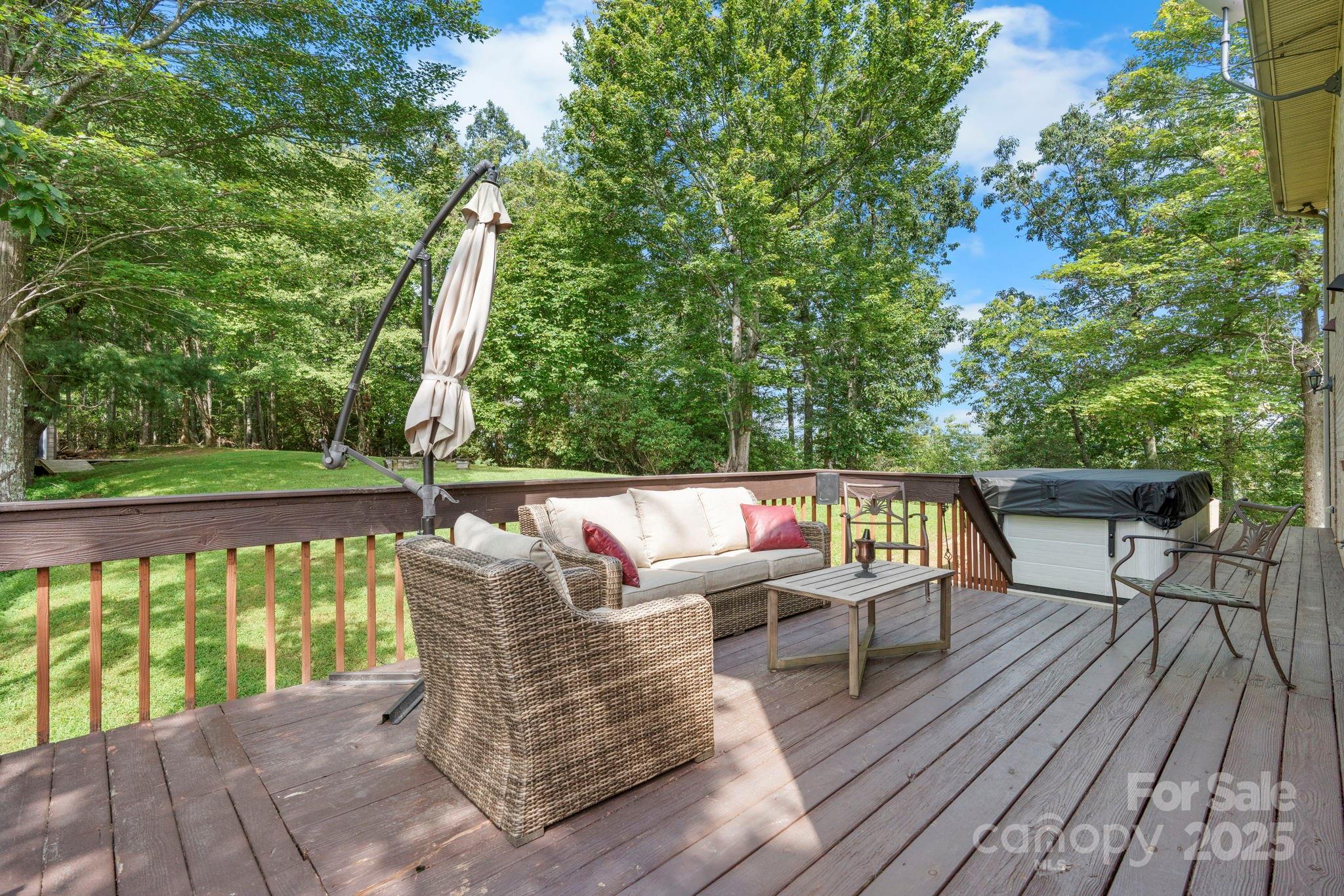 4415 Laurel Ridge Drive Lenoir, NC 28645 - Photo 31 of 48 a roof deck with table and chairs and wooden floor