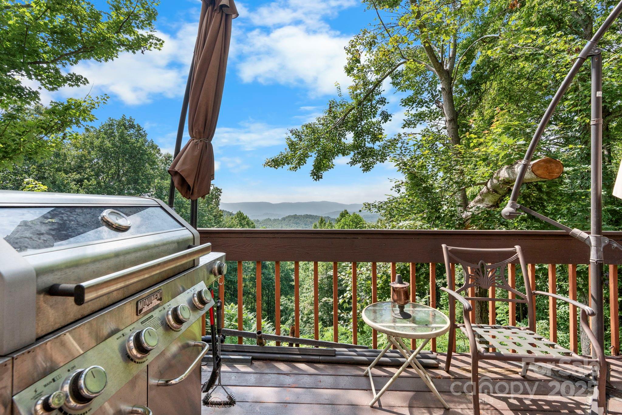 4415 Laurel Ridge Drive Lenoir, NC 28645 - Photo 32 of 48 a view of a balcony with wooden floor and outdoor seating