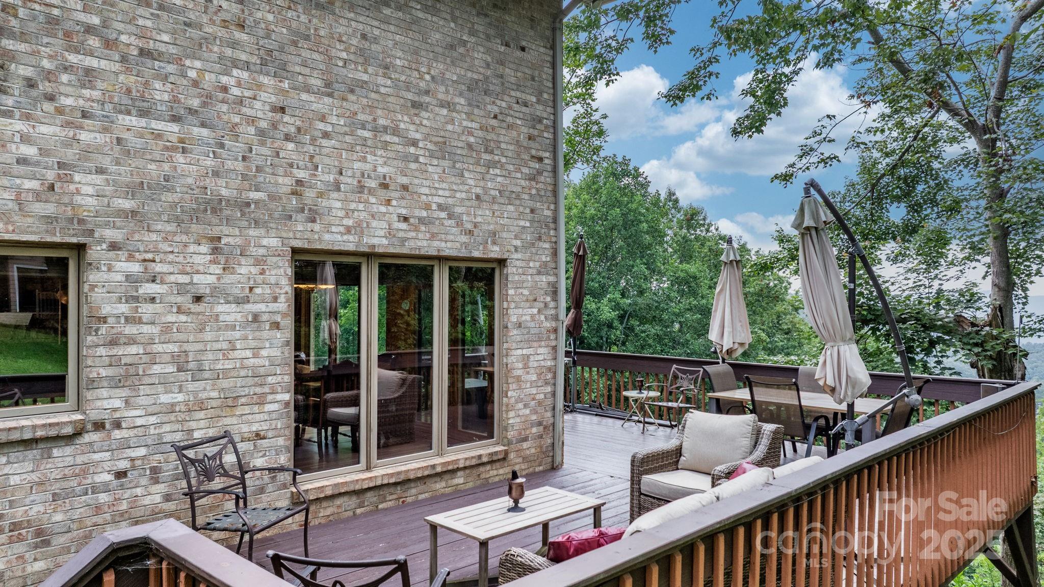 4415 Laurel Ridge Drive Lenoir, NC 28645 - Photo 33 of 48 a balcony with table and chairs