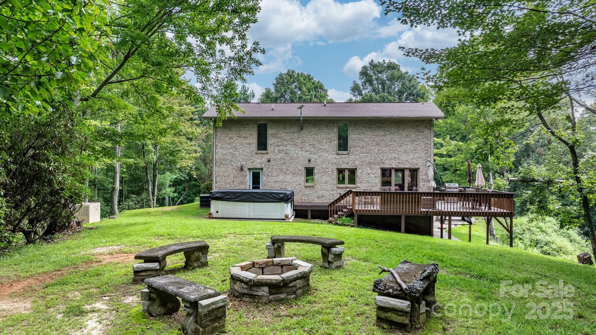 4415 Laurel Ridge Drive Lenoir, NC 28645 - Photo 34 of 48 a view of a chair and table in backyard of the house