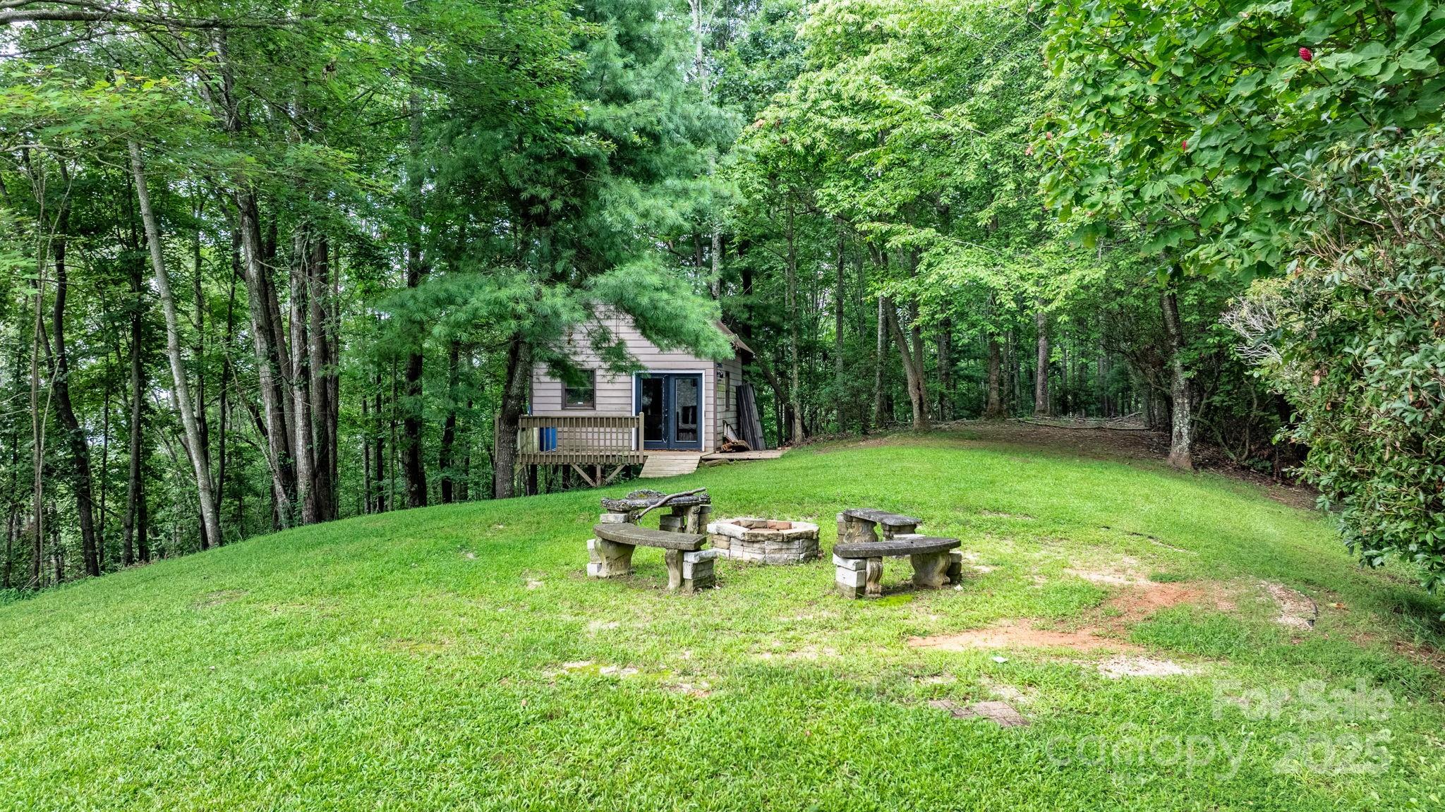 4415 Laurel Ridge Drive Lenoir, NC 28645 - Photo 35 of 48 a view of a house with backyard porch and sitting area
