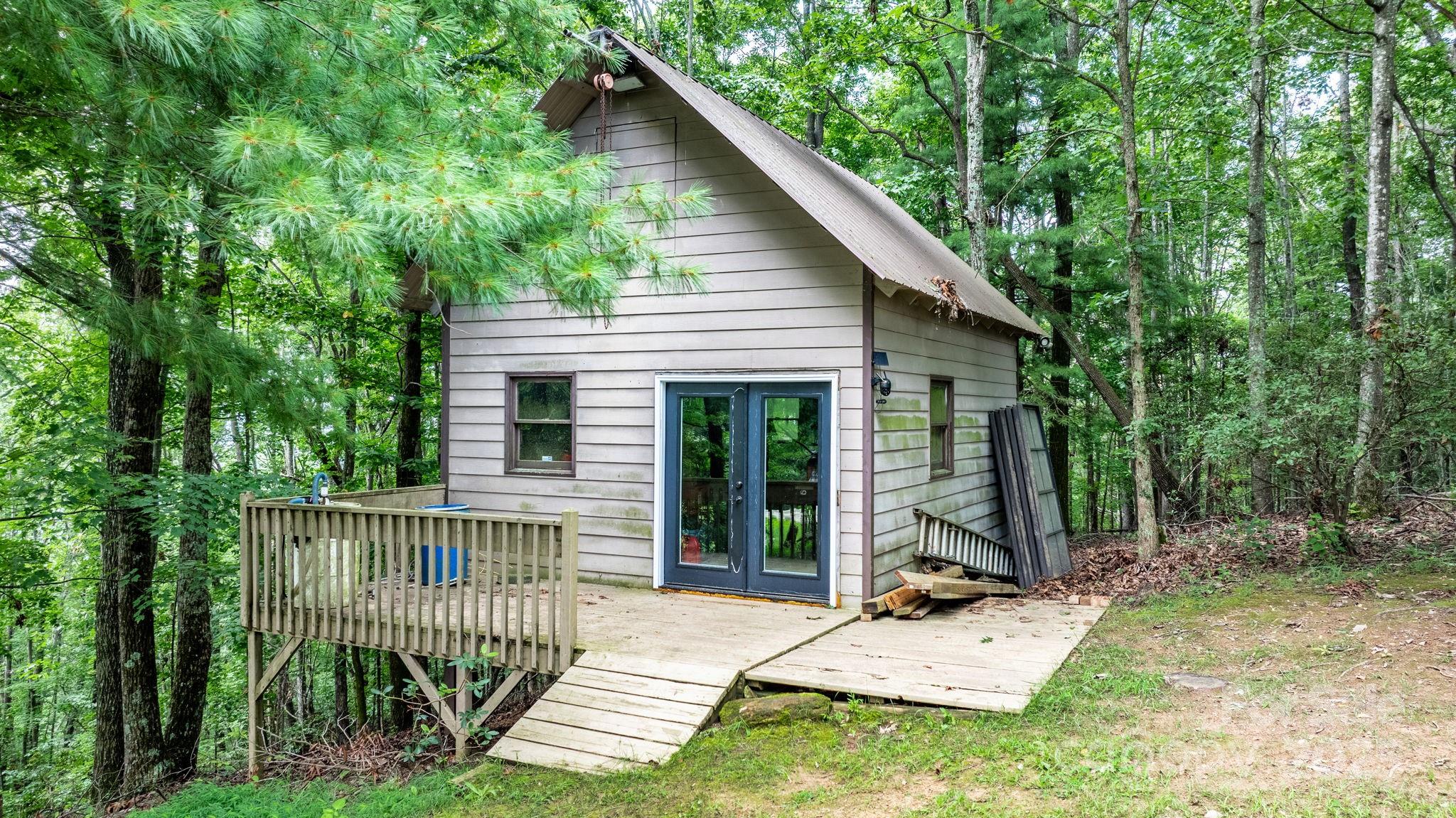 4415 Laurel Ridge Drive Lenoir, NC 28645 - Photo 36 of 48 a view of a house with backyard and porch