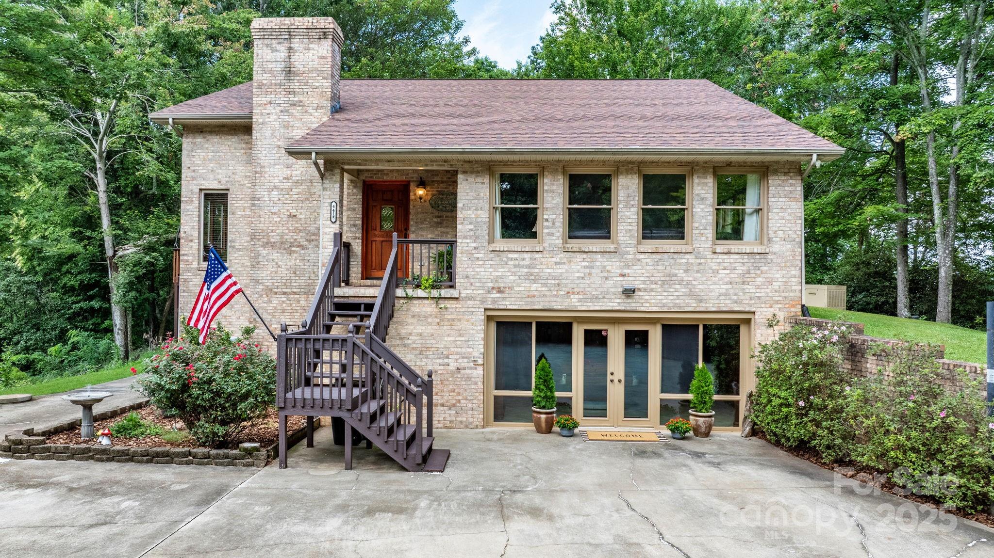 4415 Laurel Ridge Drive Lenoir, NC 28645 - Photo 37 of 48 a house view with a garden space