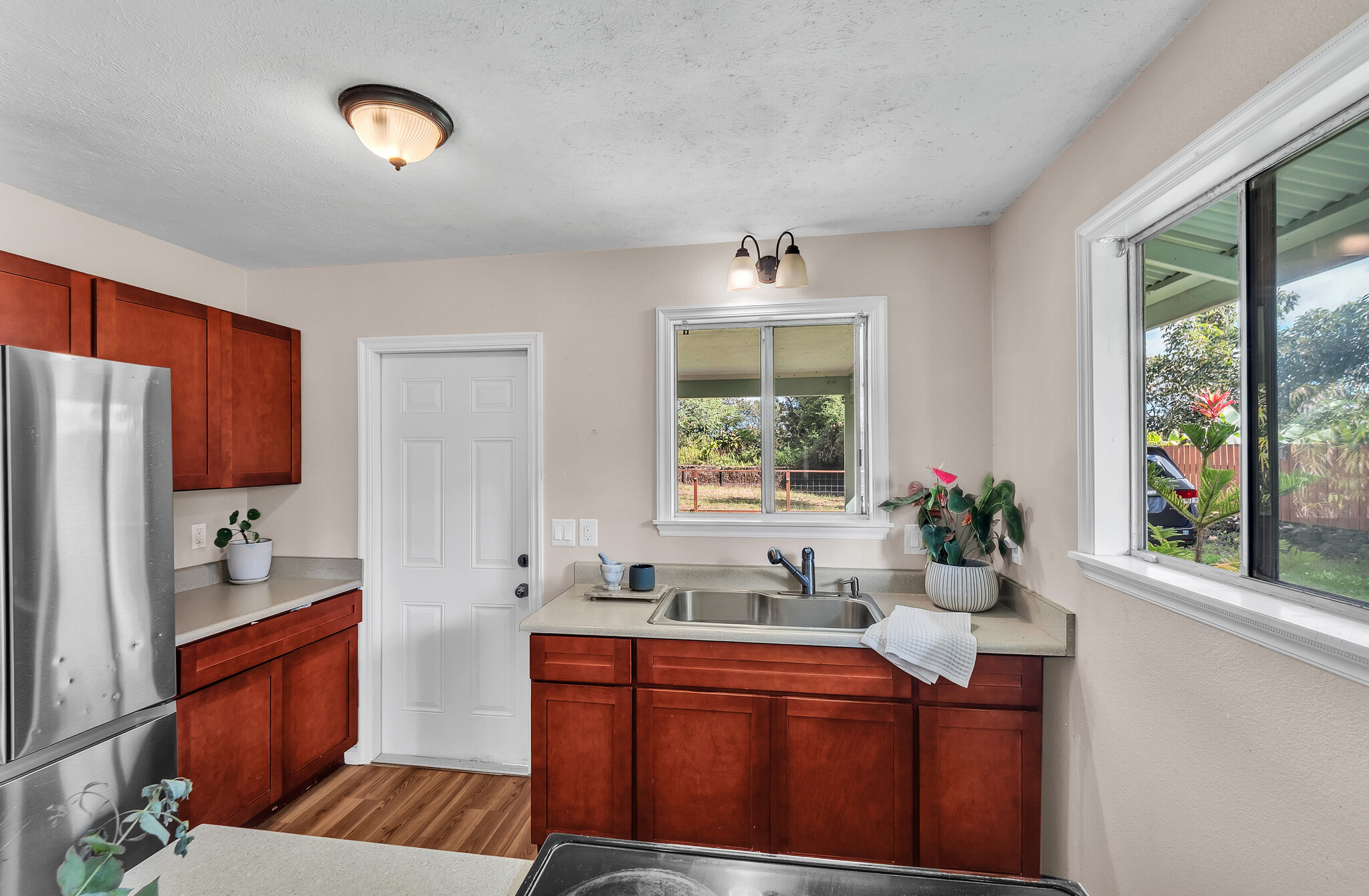 17-7658 North Kulani Road Mountain View, HI 96771 - Photo 11 of 24 a room with furniture a sink and a window