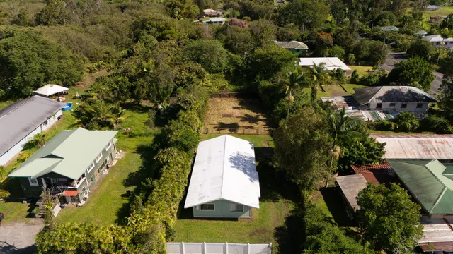 an aerial view of residential house with outdoor space