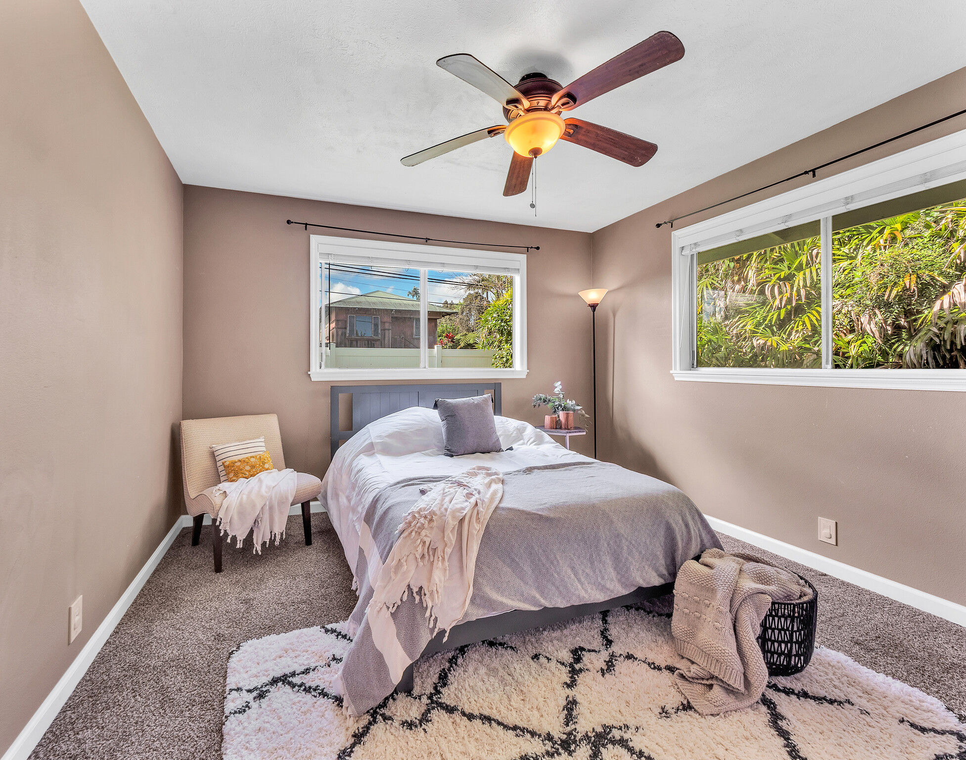 17-7658 North Kulani Road Mountain View, HI 96771 - Photo 4 of 24 a bedroom with a bed and wooden floor