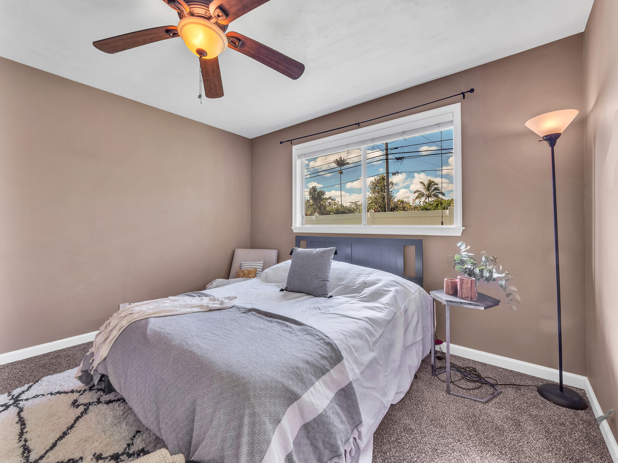 17-7658 North Kulani Road Mountain View, HI 96771 - Photo 5 of 24 a bedroom with a bed and a painting on the wall