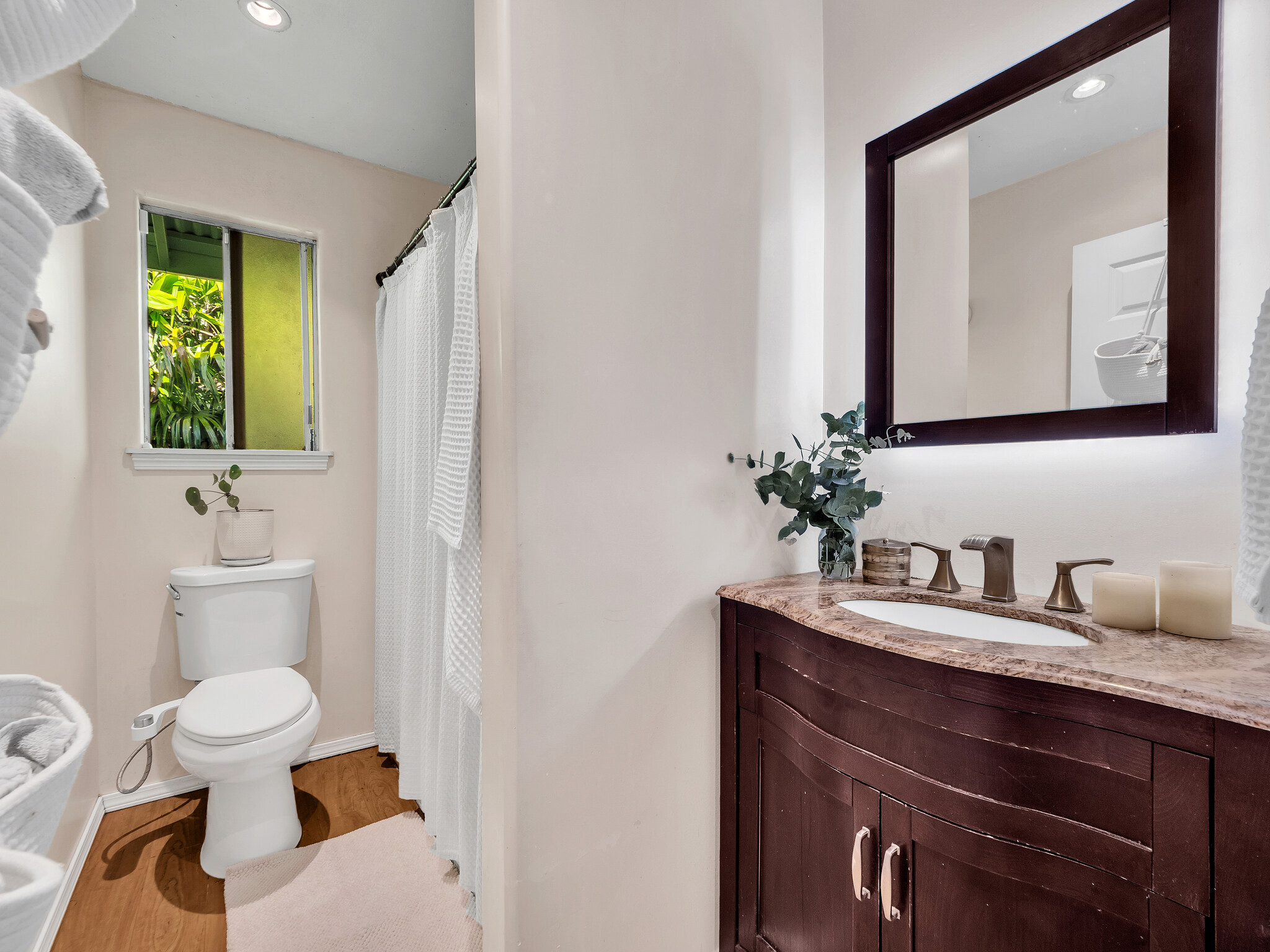 17-7658 North Kulani Road Mountain View, HI 96771 - Photo 7 of 24 a bathroom with a toilet sink and mirror