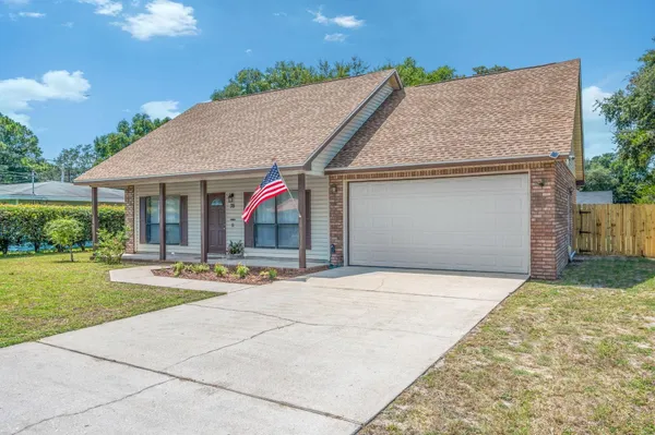 a view of house with yard and outdoor space