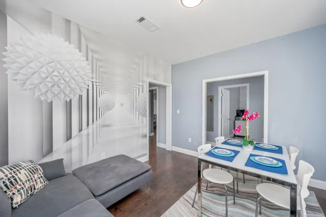 a living room with furniture and a rug