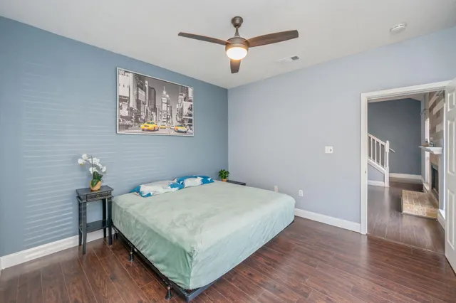 a bedroom with a bed and a table in it