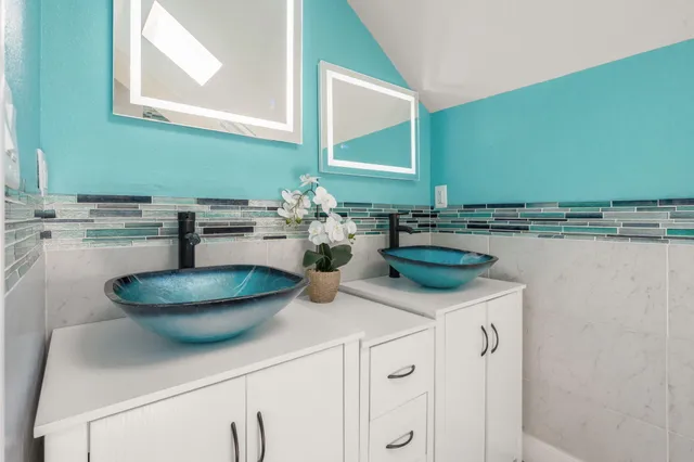 a kitchen with a sink and a stove top oven