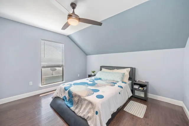 a large white bed in a white room