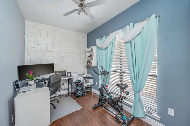 a workspace with furniture and a fireplace