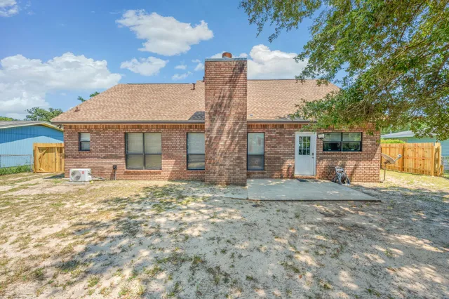 a view of a house with a yard and garage