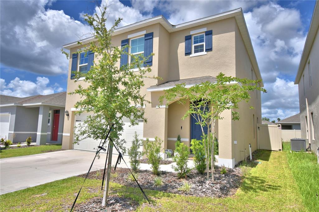 2839 Moulin Road Davenport, FL 33837 - Photo 2 of 75 a front view of a house with a yard