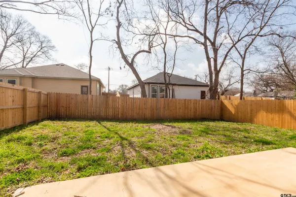 a view of a backyard of the house