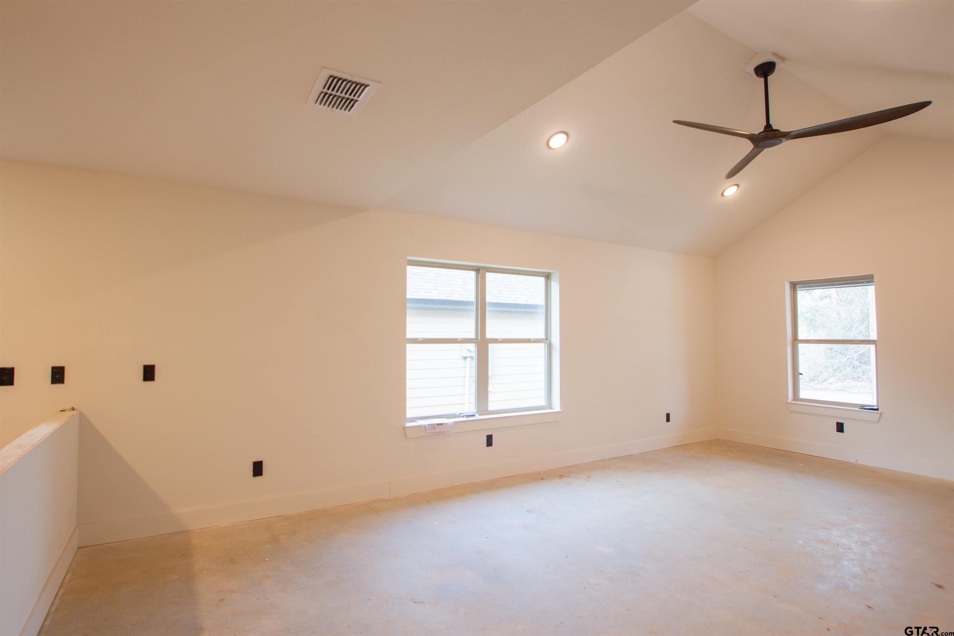 1112 Park Street Tyler, TX 75702 - Photo 5 of 26 a view of empty room with windows