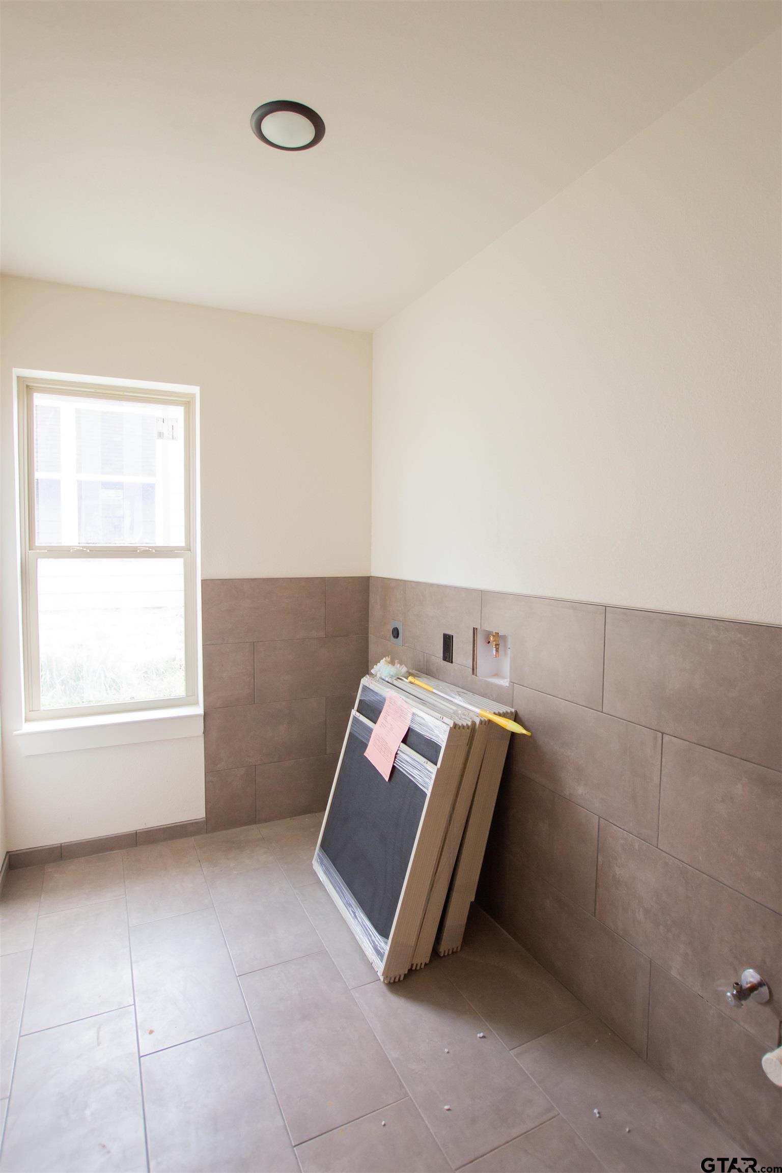 1112 Park Street Tyler, TX 75702 - Photo 7 of 26 an empty room with windows