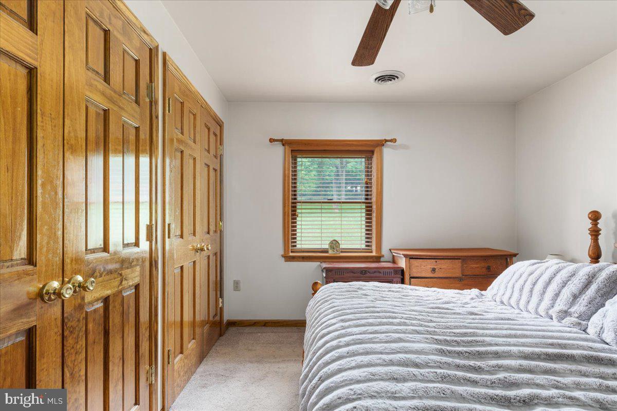 709 Dicks Hollow Road Winchester, VA 22603 - Photo 16 of 45 a bedroom with a bed and a window