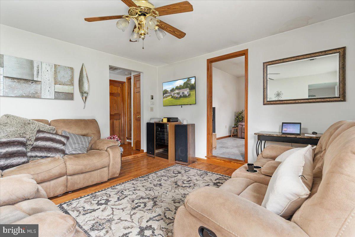 709 Dicks Hollow Road Winchester, VA 22603 - Photo 5 of 45 a living room with furniture and a flat screen tv