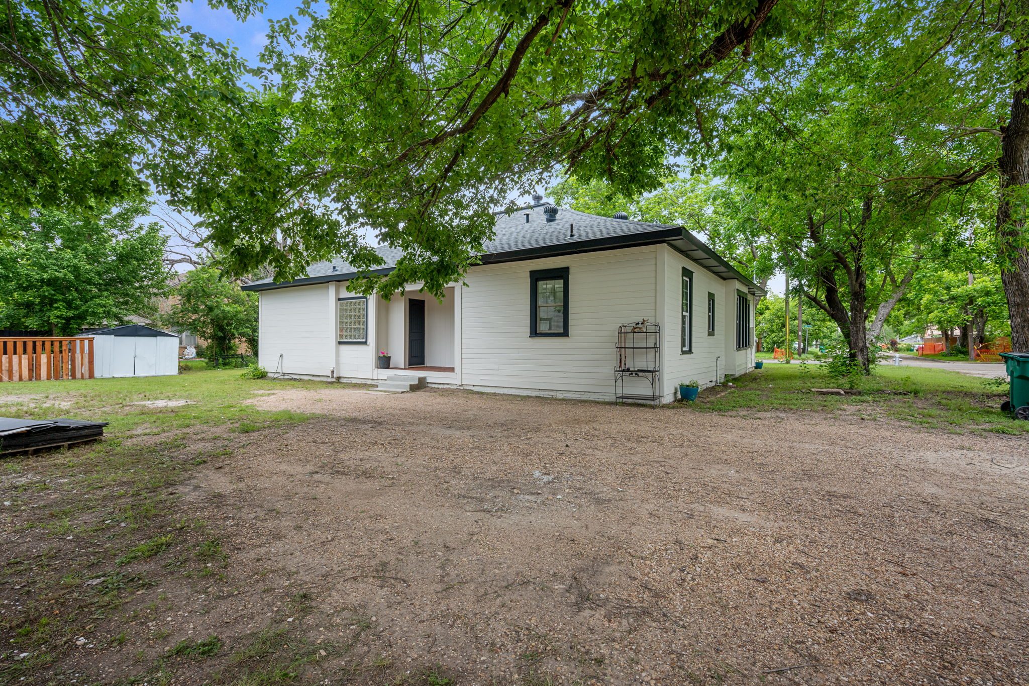 602 East 6th Street Cameron, TX 76520 - Photo 33 of 40 White exterior with black trim windows