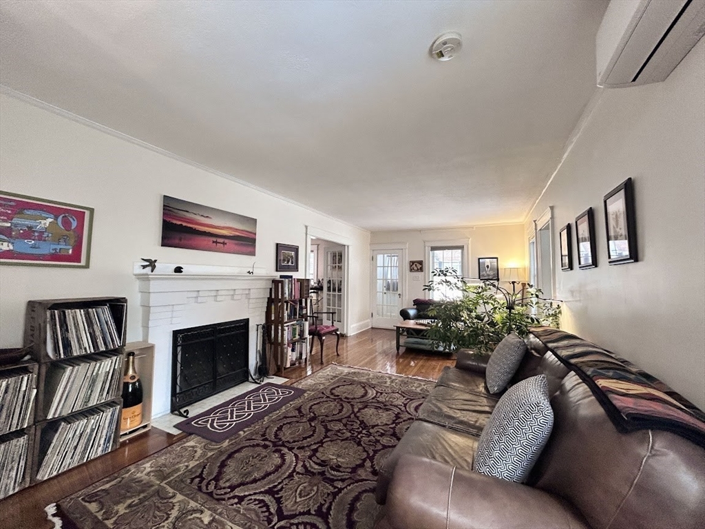 17 Longfellow Road Worcester, MA 01602 - Photo 6 of 19 a living room with furniture large window and a fireplace